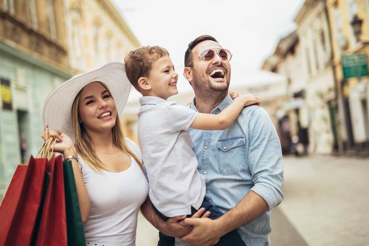 Happy family having fun outdoor after shopping